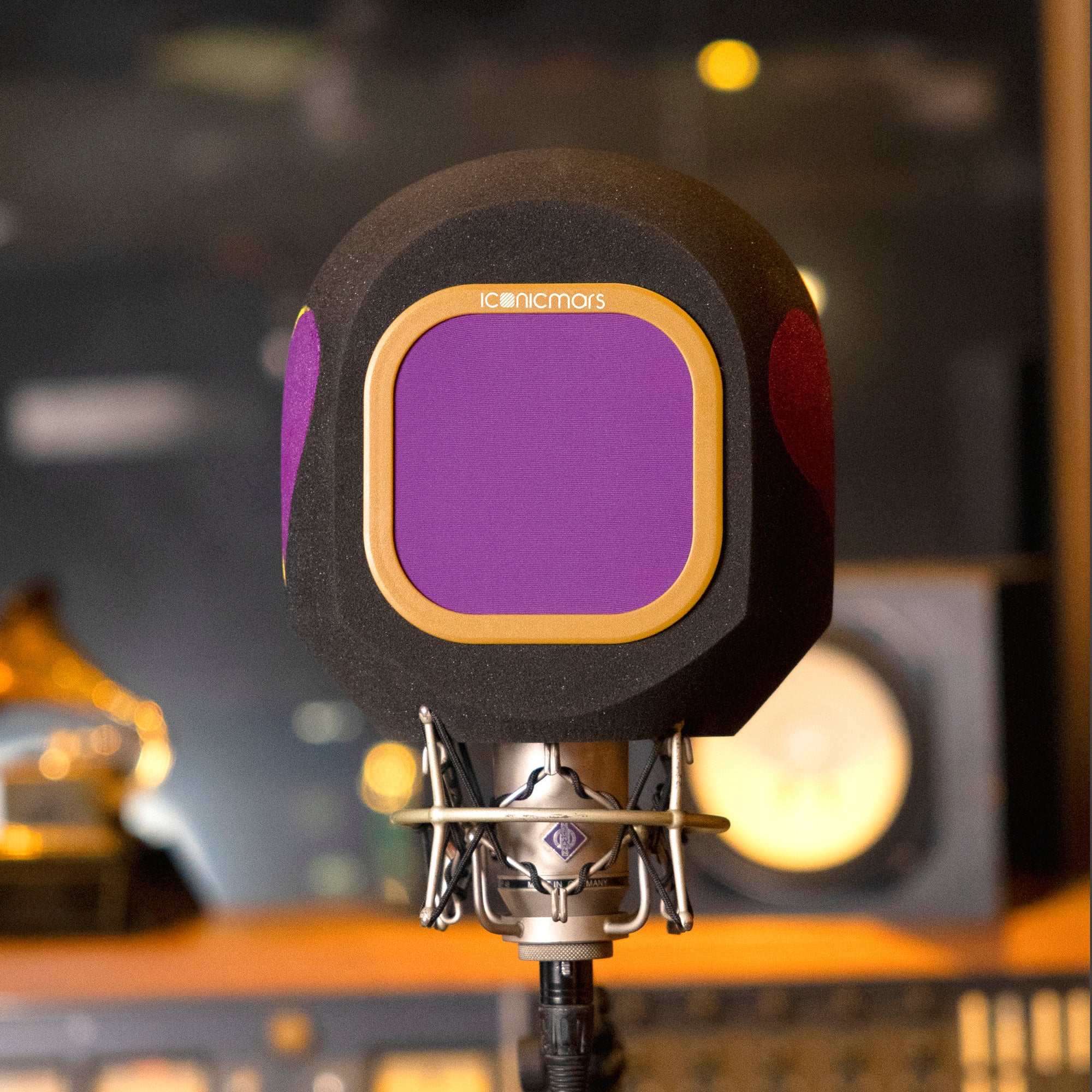 Purple hearts painted on side of iso shield with purple and tan pop filter on microphone stand