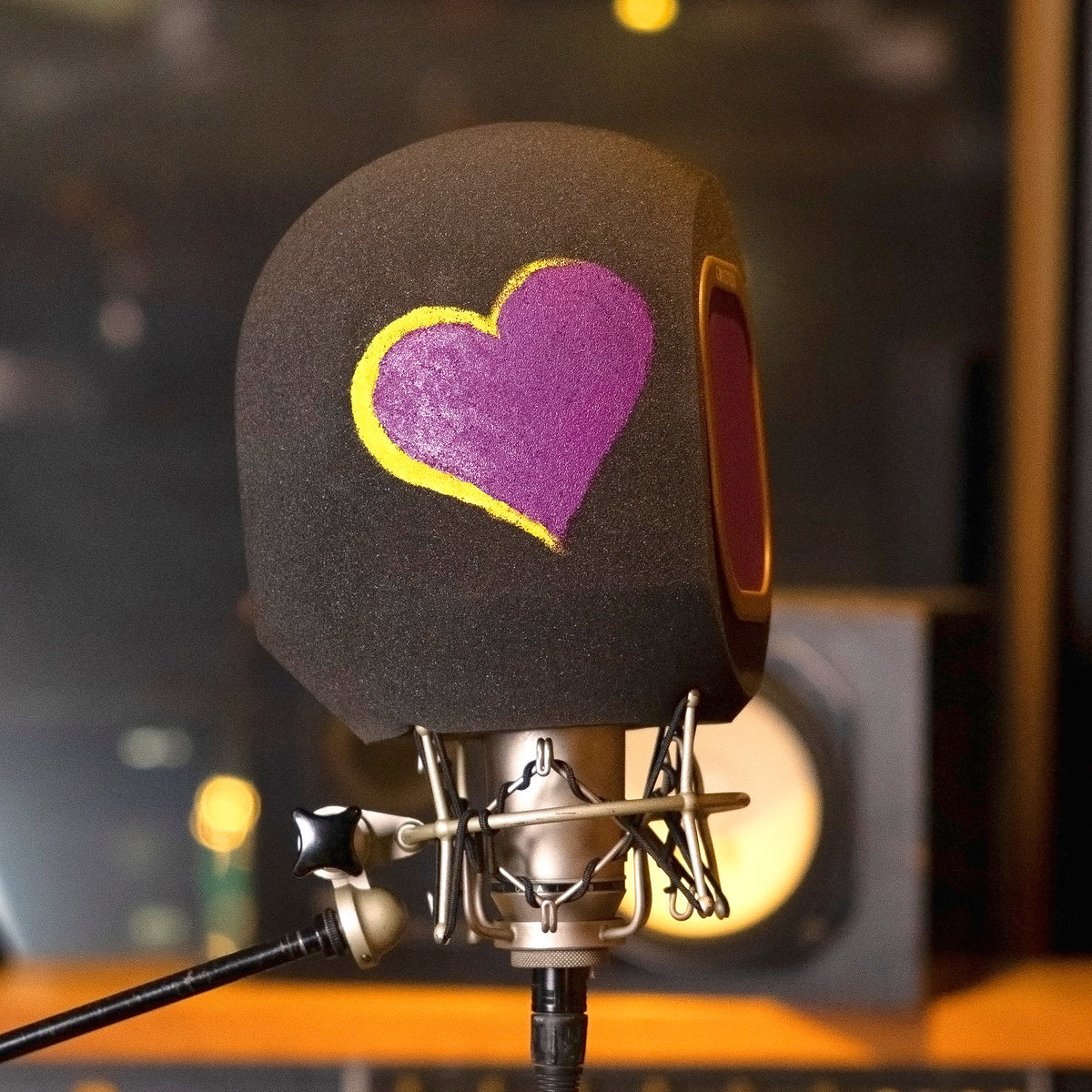 Purple and yellow hand painted design on side of iso vocal booth for asmr and live streaming 